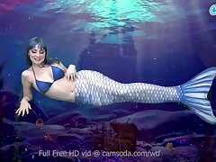 Mermaid jerks till she gets even more wet