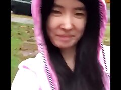 Asian Teen publicly uncovers herself in the rain!