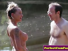 Big-chested female dom wanking boy outdoors for cum