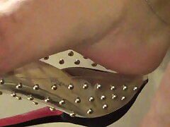 Mature feet weary and sweat-soaked in transparent boots