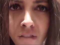 Brunette makes a selfie in the store changing rooms