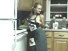 Trampy chick pokes her pussy with kitchen utensils on counter